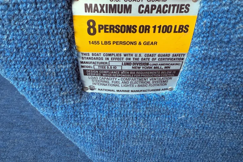 Slide: The Image of Boat capacity label on blue fabric, Lund 1988, 8 persons or 1100 lbs. - 12