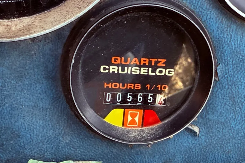 Slide: The Image of 1988 Lund Quartz Cruiselog displaying 56.5 hours on a blue dashboard. - 14