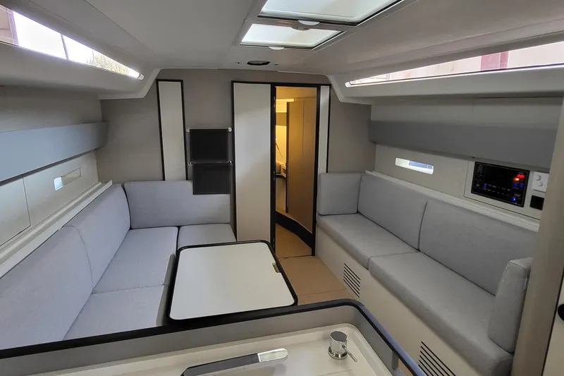 Slide: The Image of Modern interior of 2026 Italia Yachts 12.98, featuring sleek seating and natural light. - 2