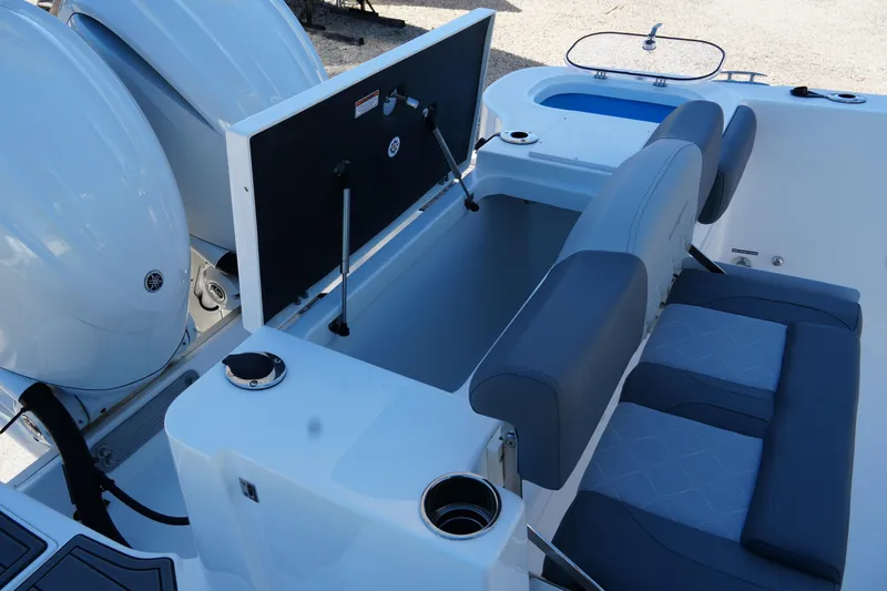 Slide: The Image of 2025 NauticStar 292 Legacy boat interior with seating and storage compartments. - 12