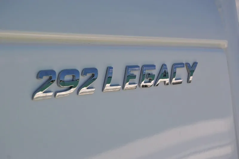 Slide: The Image of 2025 NauticStar 292 Legacy boat emblem on white surface. - 4