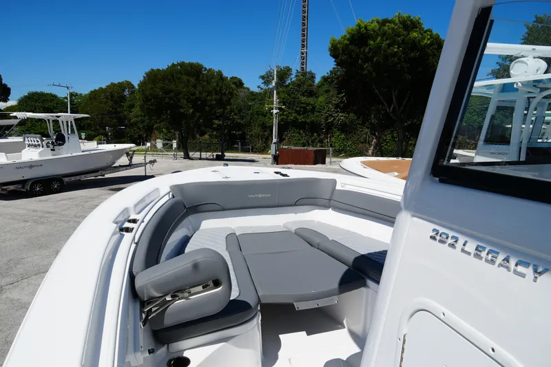 Slide: The Image of 2025 NauticStar 292 Legacy boat with sleek seating and modern design. - 8