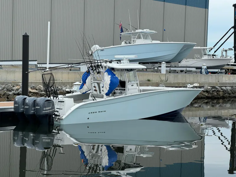 The Image of 2017 Cape Horn 36 XS boat docked with fishing rods and Yamaha engines. - 1
