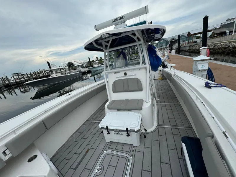 Slide: The Image of 2017 Cape Horn 36 XS boat docked, featuring spacious deck and modern design. - 12