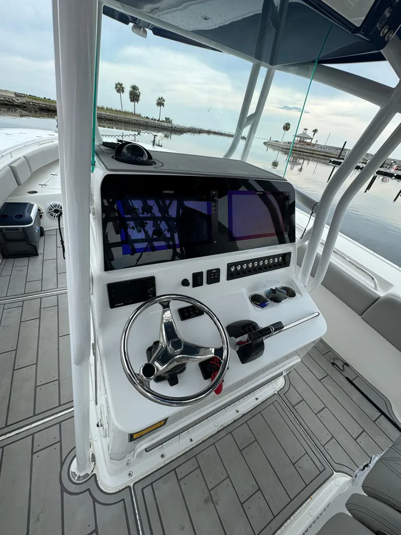 Slide: The Image of 2017 Cape Horn 36 XS boat dashboard with steering wheel and navigation controls. - 7
