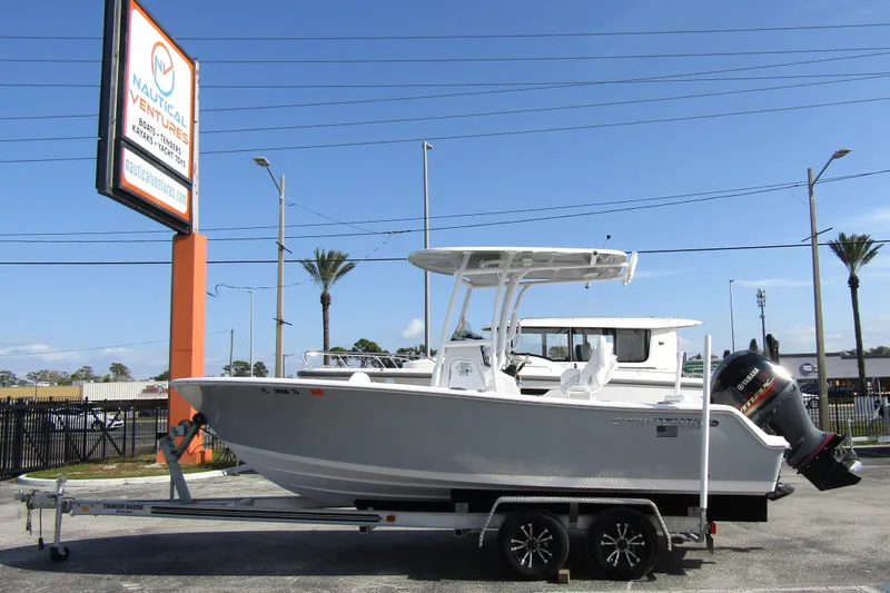 The Image of 2023 Sportsman Open 212 Center Console boat on trailer at Nautical Ventures dealership. - 0