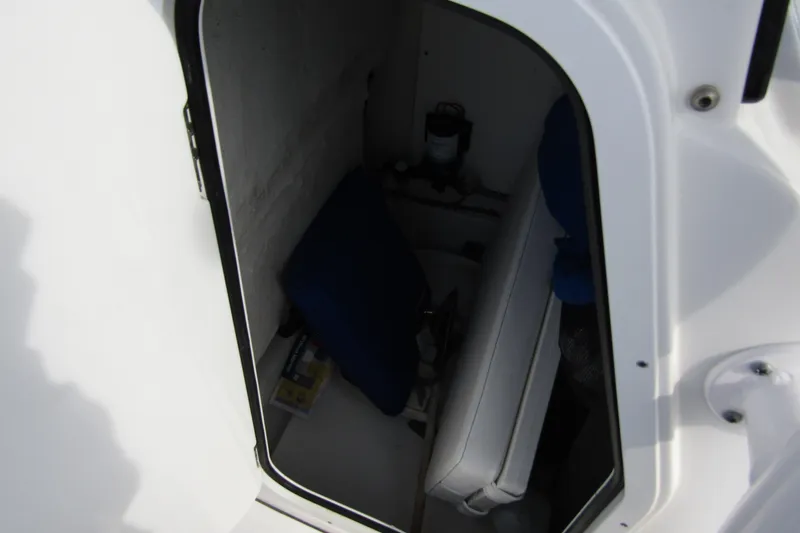 Slide: The Image of 2023 Sportsman Open 212 Center Console storage compartment interior view. - 17
