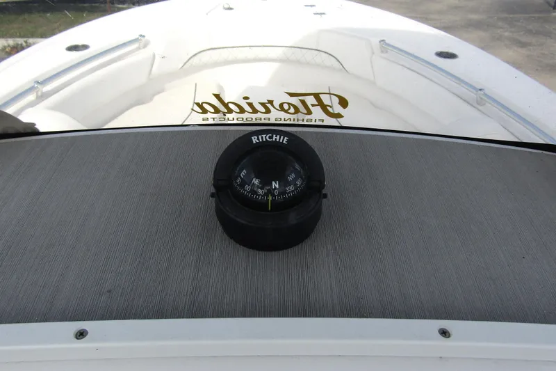 Slide: The Image of 2023 Sportsman Open 212 Center Console with Ritchie compass on dashboard. - 20