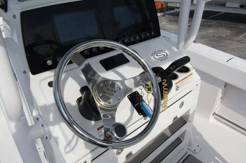 Slide: The Image of 2023 Sportsman Open 212 Center Console steering wheel and dashboard controls. - 22