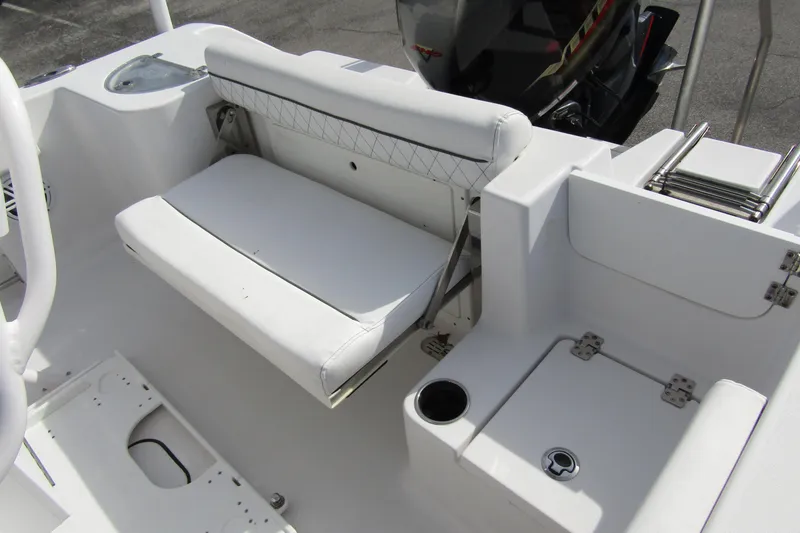 Slide: The Image of 2023 Sportsman Open 212 Center Console boat interior with seating and storage compartments. - 29