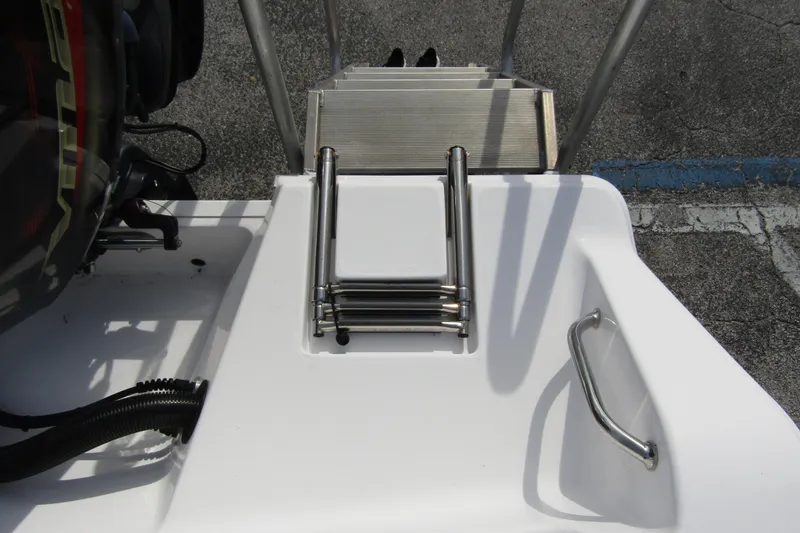 Slide: The Image of 2023 Sportsman Open 212 Center Console boat with foldable ladder and handle. - 36