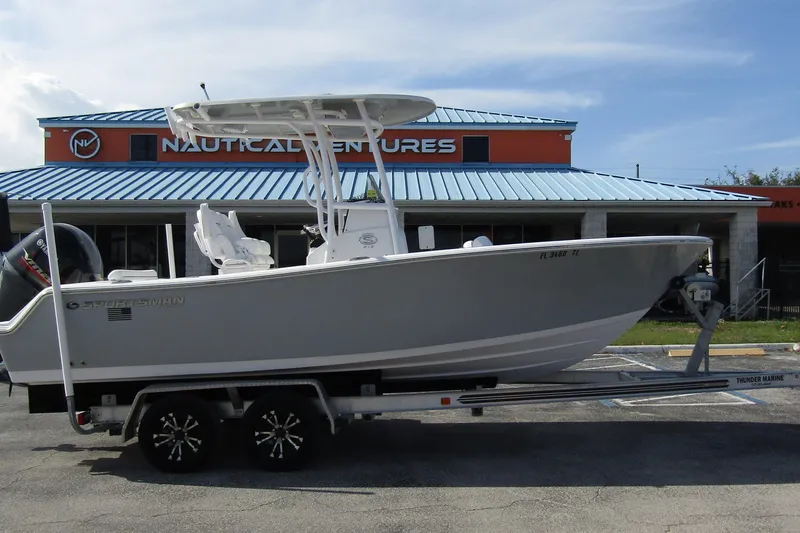 Slide: The Image of 2023 Sportsman Open 212 Center Console boat on trailer outside Nautical Ventures. - 5