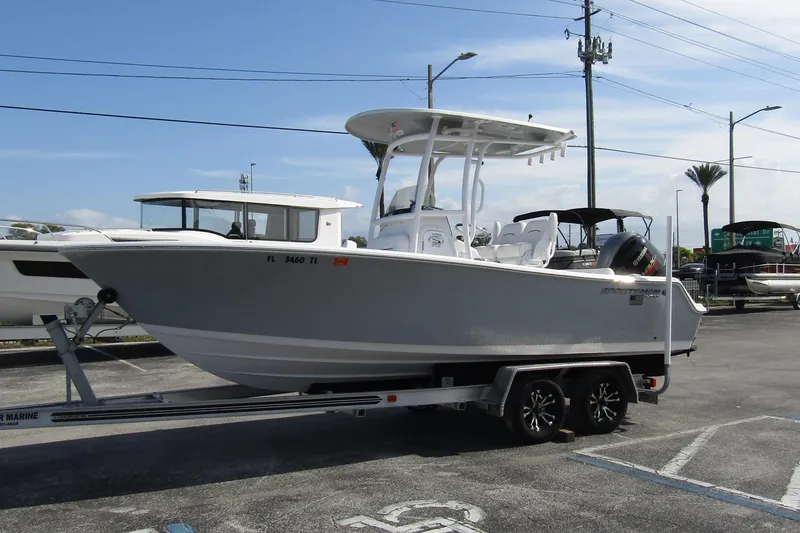 Slide: The Image of 2023 Sportsman Open 212 Center Console boat on trailer in parking lot. - 7