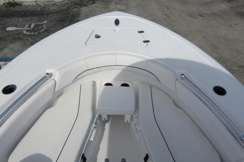 Slide: The Image of 2023 Sportsman Open 212 Center Console boat interior with seating and storage. - 8