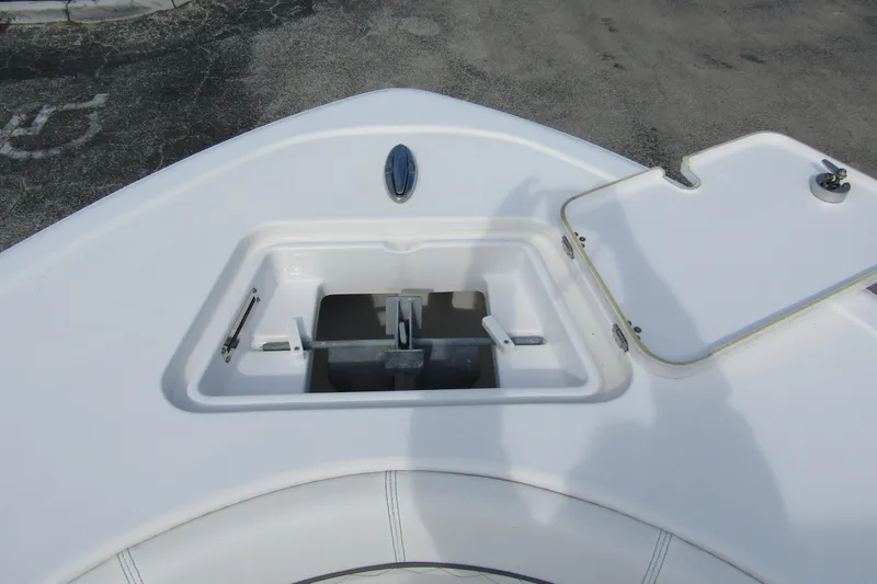 Slide: The Image of 2023 Sportsman Open 212 Center Console anchor storage compartment on deck. - 9