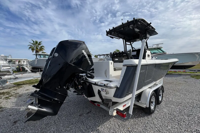 Slide: The Image of 2021 Sea Born LX26 Center Console boat with Mercury engine on trailer. - 12