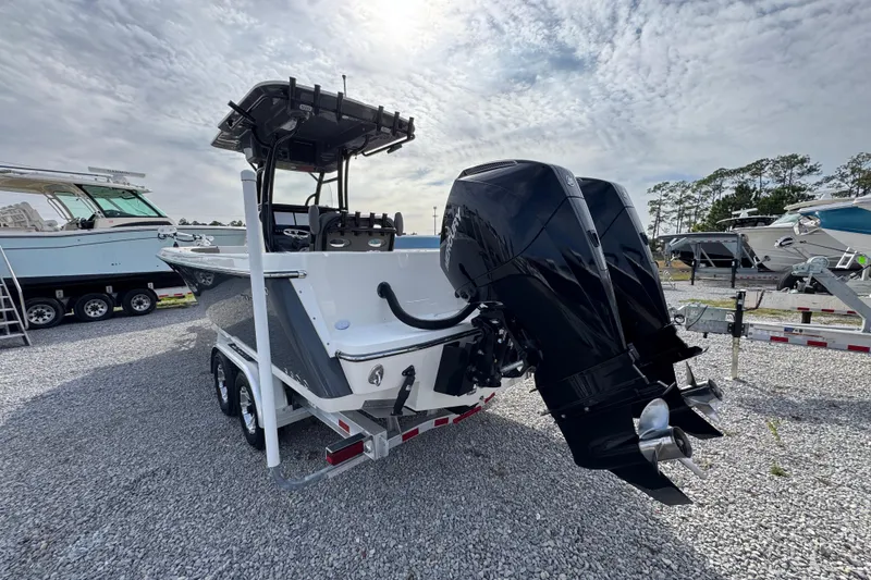 Slide: The Image of 2021 Sea Born LX26 Center Console boat with dual engines on a trailer. - 14