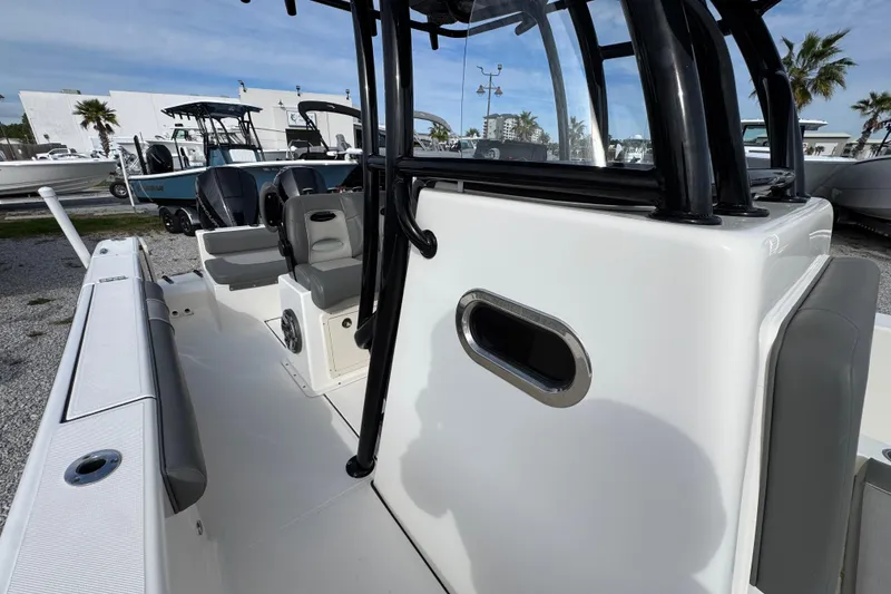 Slide: The Image of 2021 Sea Born LX26 Center Console boat interior with seating and console details. - 25