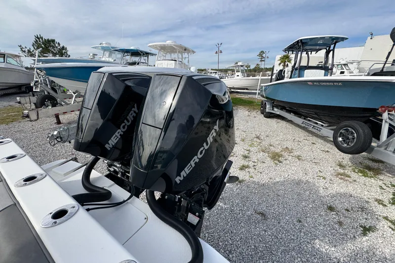 Slide: The Image of 2021 Sea Born LX26 Center Console with dual Mercury engines in a boatyard. - 41