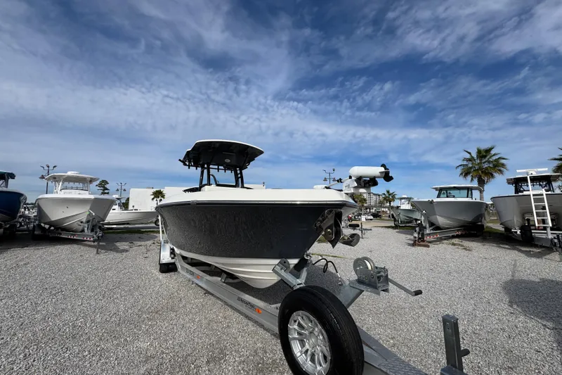 Slide: The Image of 2021 Sea Born LX26 Center Console boat on trailer under blue sky. - 5