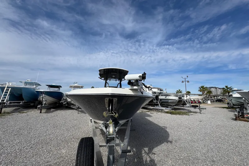 Slide: The Image of 2021 Sea Born LX26 Center Console boat on trailer under blue sky. - 6