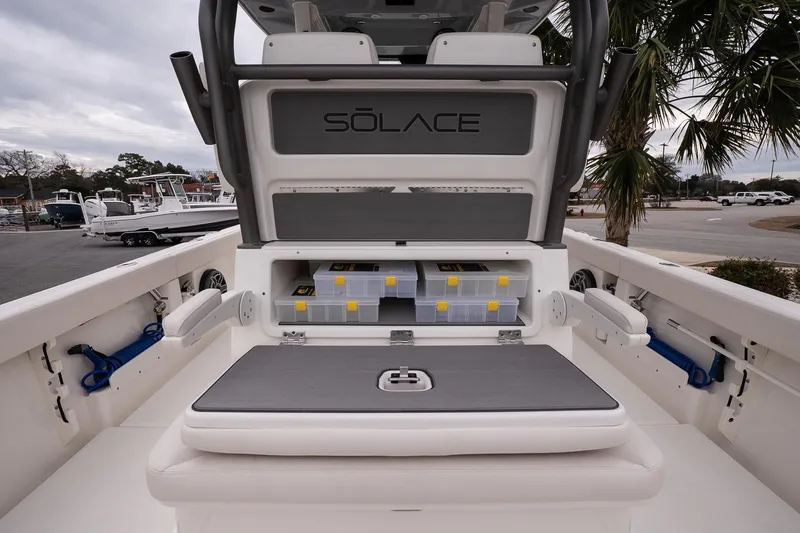 Slide: The Image of 2026 Solace 28 HCS boat interior with storage compartments and seating. - 12