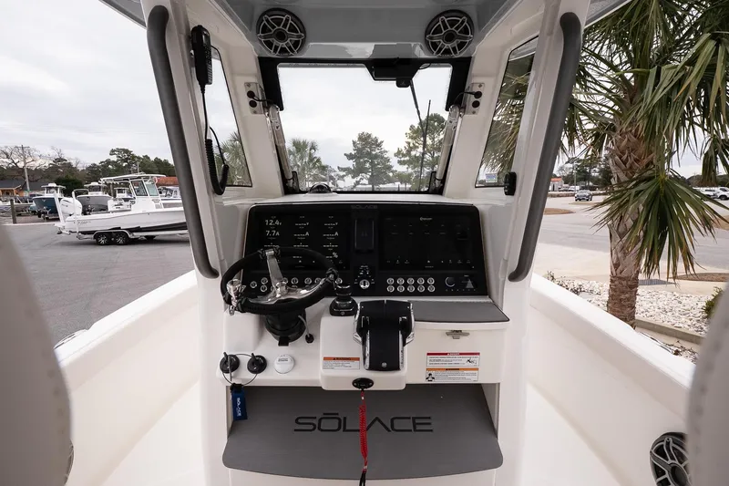 Slide: The Image of Cockpit view of 2026 Solace 28 HCS boat with advanced navigation controls. - 16