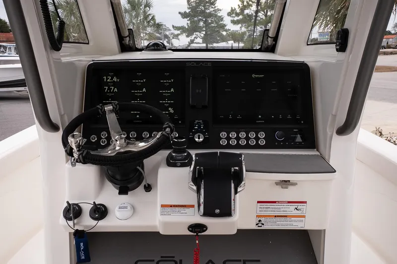 Slide: The Image of 2026 Solace 28 HCS boat dashboard with advanced controls and navigation displays. - 17