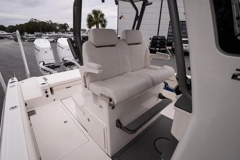 Slide: The Image of Luxurious seating on 2026 Solace 28 HCS boat, featuring dual outboard engines. - 19