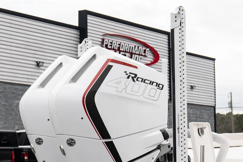 Slide: The Image of Twin Racing 400 outboard engines on a 2026 Solace 28 HCS boat at Performance Testing facility. - 9