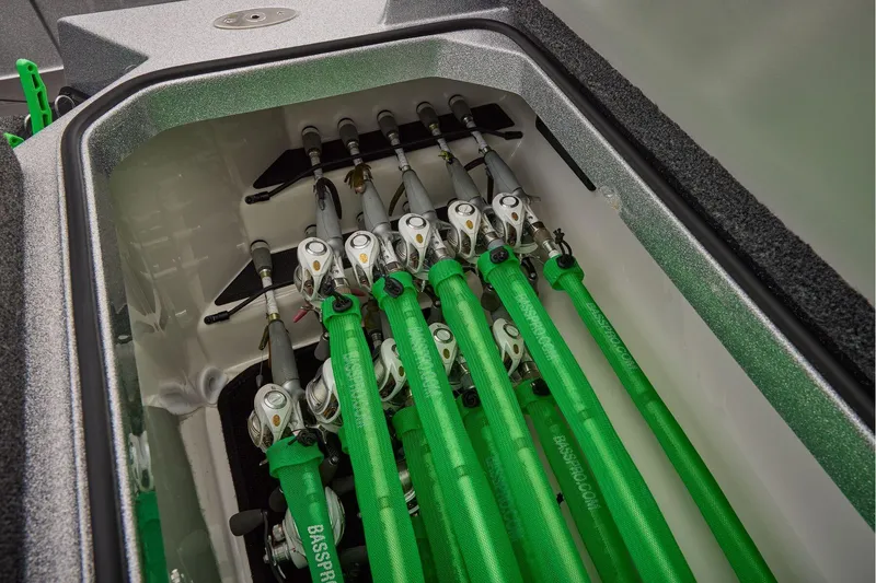 Slide: The Image of Manufacturer Provided Image: 2026 Ranger Z520 boat rod storage with green rod covers and organized fishing gear. - 34