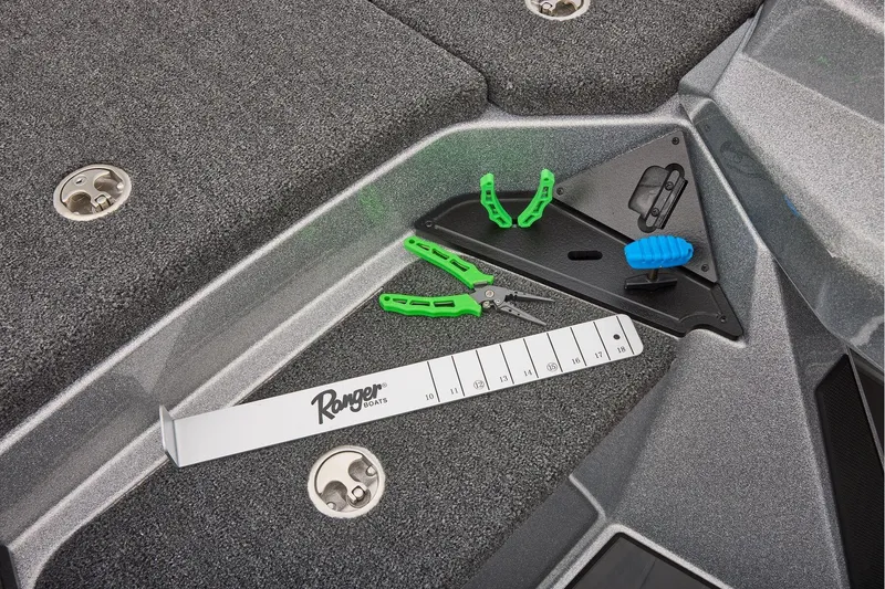 Slide: The Image of Manufacturer Provided Image: 2026 Ranger Z520 boat deck with fishing tools and measuring board. - 40