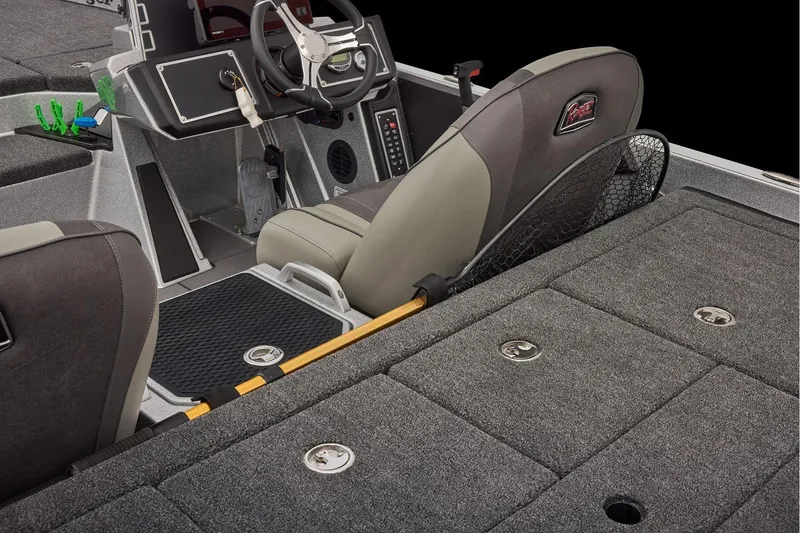 Slide: The Image of Manufacturer Provided Image: 2026 Ranger Z520 boat interior with steering wheel, seat, and storage compartments. - 66
