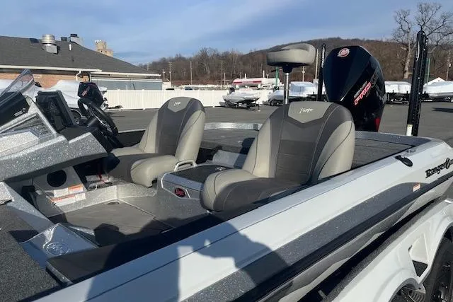 Slide: The Image of 2026 Ranger Z520 boat with dual seats and modern dashboard, parked outdoors. - 7