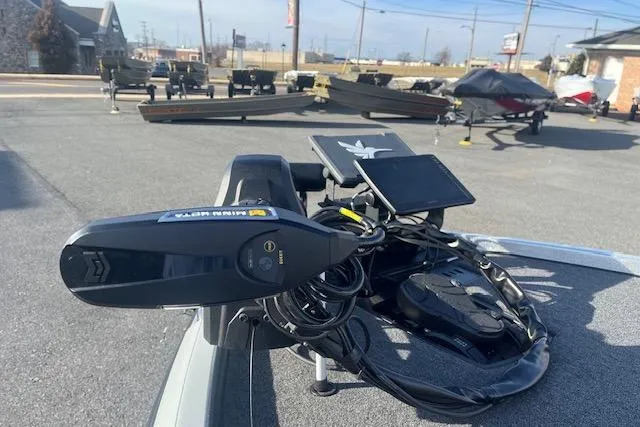 Slide: The Image of 2026 Ranger Z520 boat with advanced navigation equipment in a parking lot. - 83