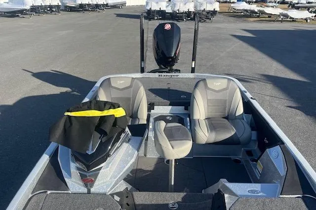 Slide: The Image of 2026 Ranger Z520 boat with dual seats and motor, parked on concrete surface. - 91