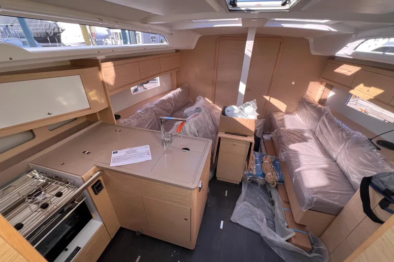Slide: The Image of Modern interior of 2026 Dufour 37 yacht with kitchen and seating area. - 10