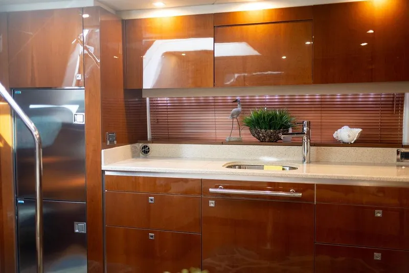 Slide: The Image of Luxurious kitchen interior of 2009 Searay 43 Sundancer yacht with wood cabinetry. - 15