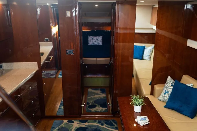 Slide: The Image of Luxurious 2009 Searay 43 Sundancer yacht interior with elegant wood finish and plush seating. - 19