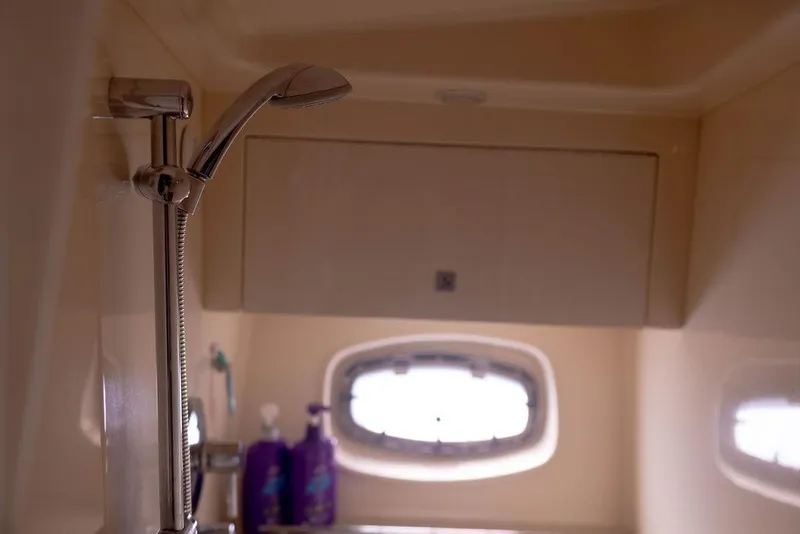 Slide: The Image of Shower area in 2009 Searay 43 Sundancer yacht with window and toiletries. - 23