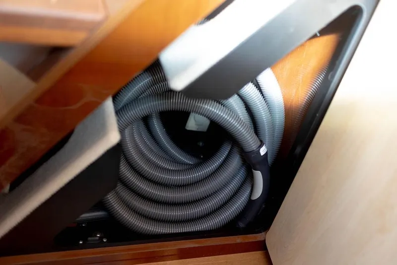 Slide: The Image of Coiled hose storage in 2009 Searay 43 Sundancer yacht interior. - 31