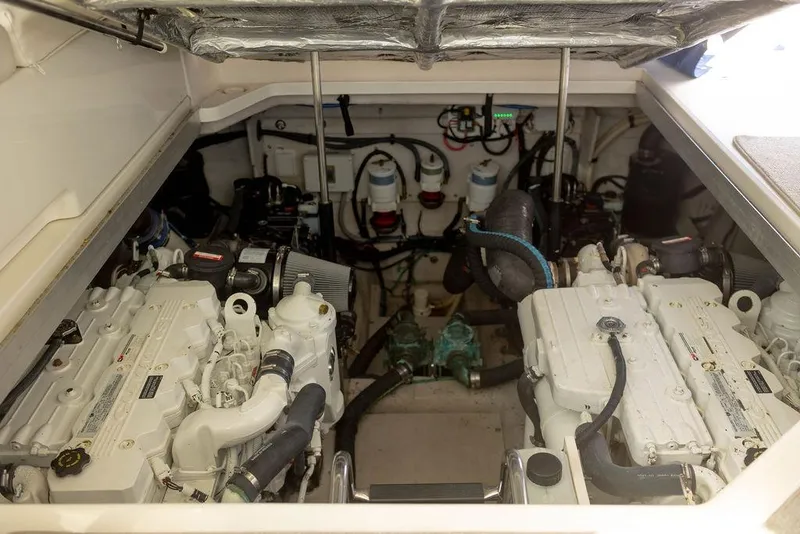 Slide: The Image of Engine room of 2009 Searay 43 Sundancer with dual engines and mechanical components. - 35