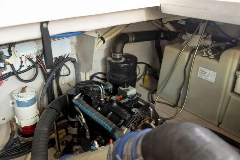 Slide: The Image of Engine room of 2009 Searay 43 Sundancer, showcasing mechanical components and wiring. - 39