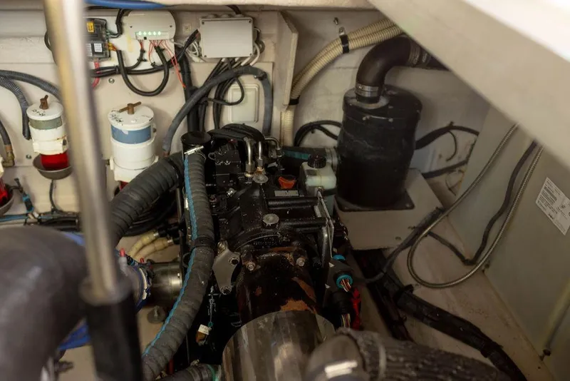 Slide: The Image of Engine room of 2009 Searay 43 Sundancer with visible components and wiring. - 40