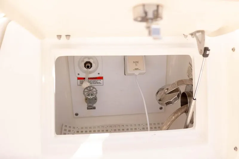 Slide: The Image of 2009 Searay 43 Sundancer utility compartment with phone and TV connections. - 41