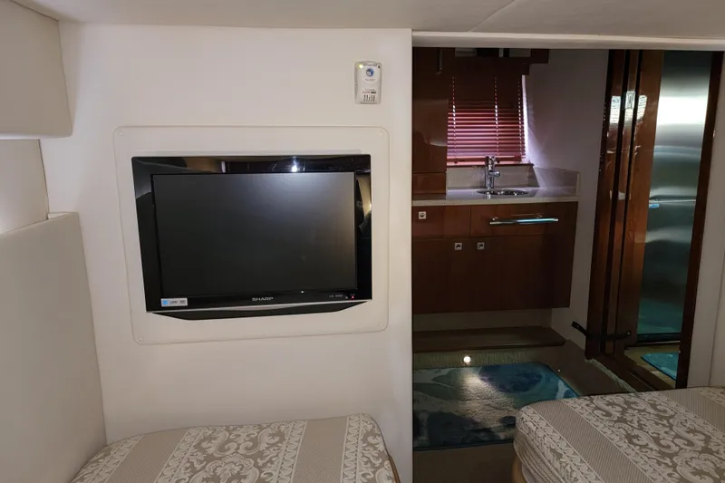 Slide: The Image of Interior of 2009 Searay 43 Sundancer yacht with TV and kitchenette. - 44