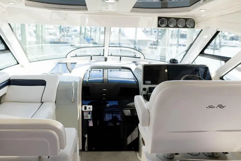 Slide: The Image of Interior of 2009 Searay 43 Sundancer yacht with modern helm and seating. - 8