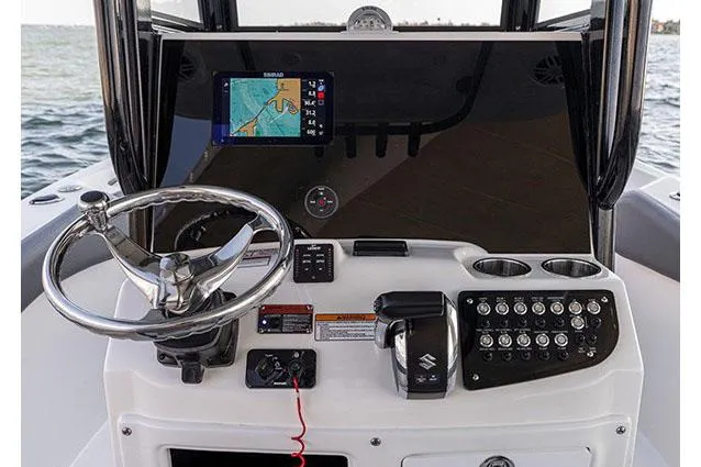 Slide: The Image of Manufacturer Provided Image: NauticStar 242 Offshore 2025 boat console with steering and navigation system. - 7