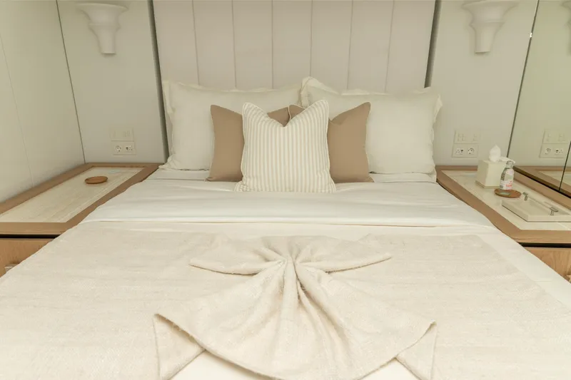 Slide: The Image of Luxurious bedroom interior on 2024 Sunreef 80 Power Cat yacht, featuring elegant bedding and decor. - 14