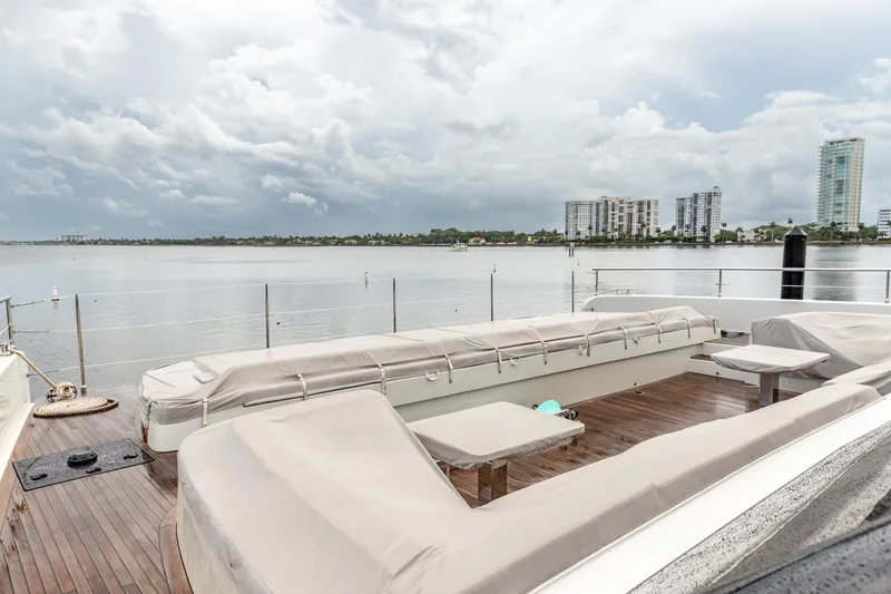 Slide: The Image of Luxurious Sunreef 80 Power Cat 2024 yacht deck with waterfront cityscape view. - 17